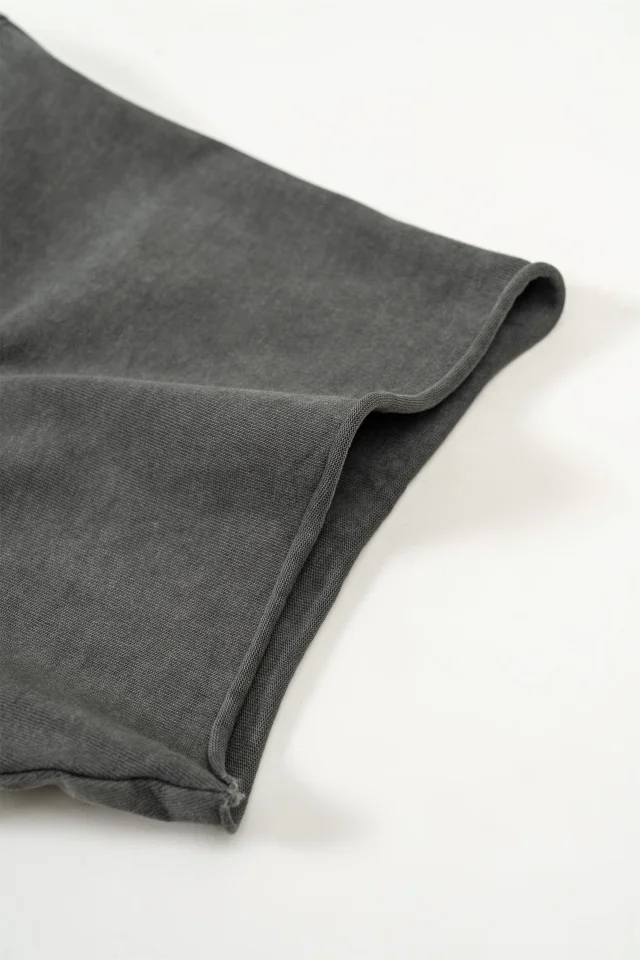 Double-stitched seams at the back neck, shoulder lines, and shoulder sleeve seams